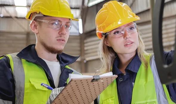 work people wearing hard hats and high vis jackets